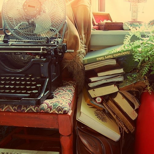 books, chair and clutter