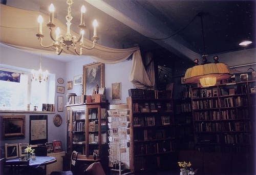 books, cabinet and chandelier