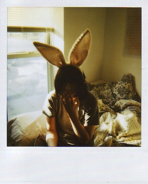 bed, bunny ears and cigarette