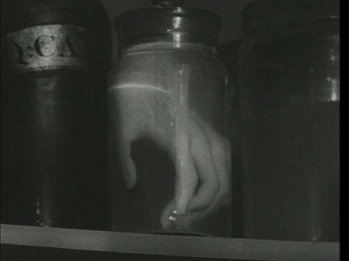 black and white, hand in jar and macabre