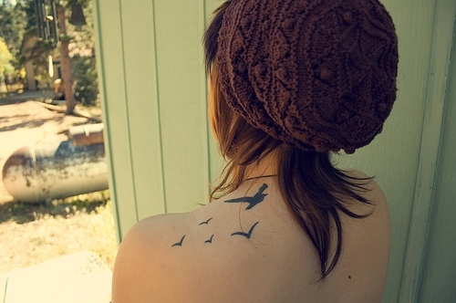 back,  beanie and  bird tattos