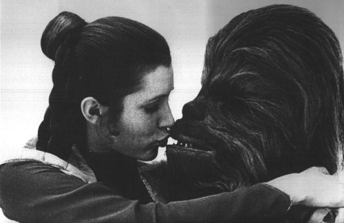 black and white carrie fisher chebacca kiss princess leia star wars