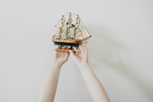 hands, miniature and ship