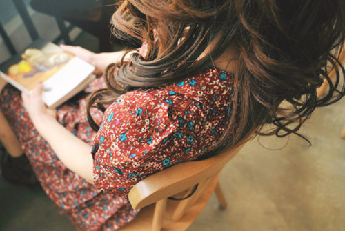 book, brunette and curly