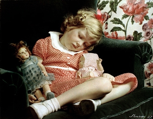 child, couch and dolls