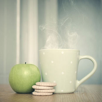 apple, crackers and cup