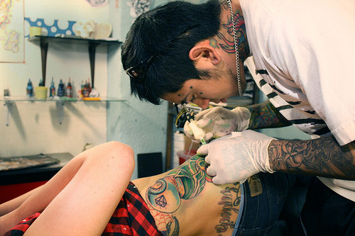 getting a tattoo, girl getting tattoo and guy