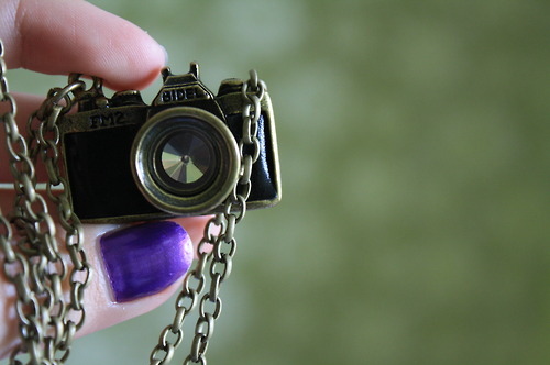 camera, nails and necklace