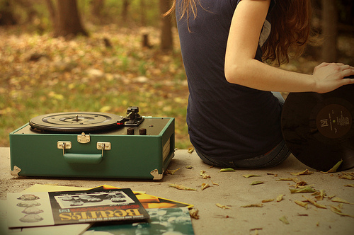 girl, leaves and old recordplayer