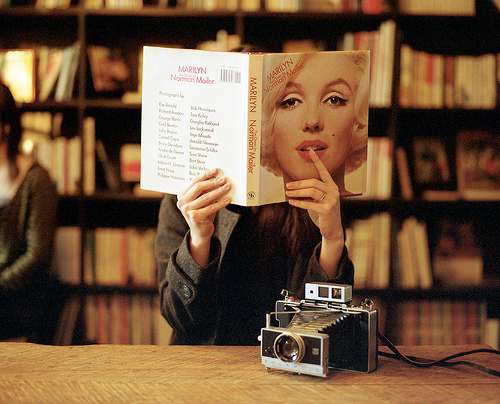 blonde, book and camera