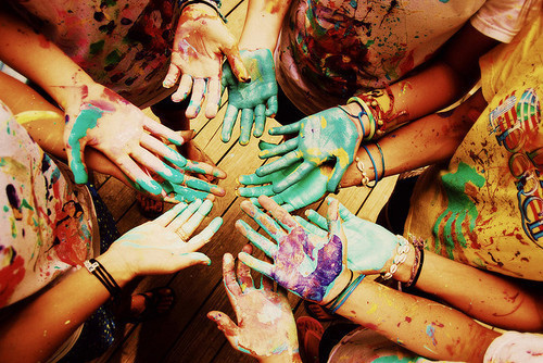 colorful, open hands and painty