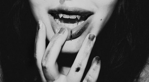 black and white,  blood and  fangs