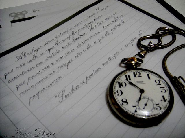 clock, notebook and quotation