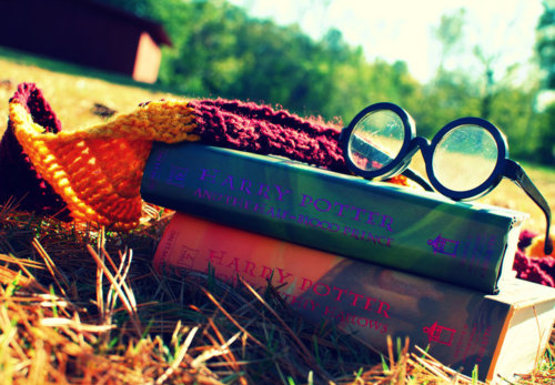 books, deathly hallows and glasses