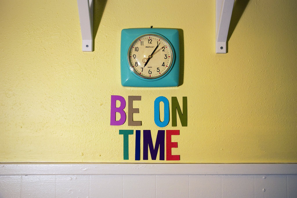 be on time, clock and letter