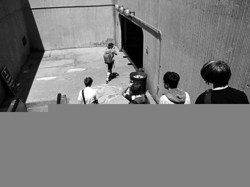 black and white, boys and escalator