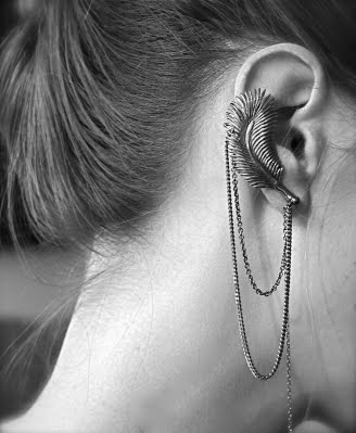 chain, earring and feather