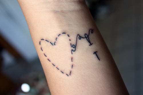 heart, needle and tattoo