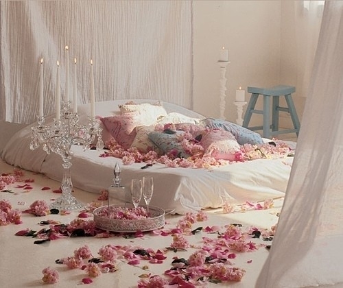 bed, candles and flowers