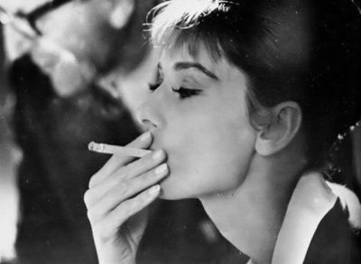 audrey hepburn,  black and white and  cigarette