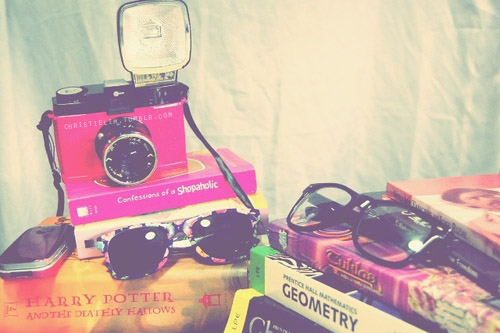 books, camera and glasses