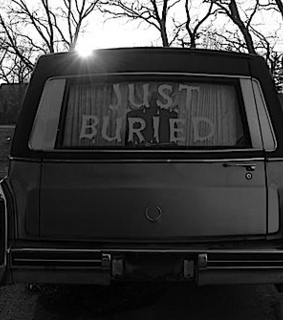 automobile, black and white and buried