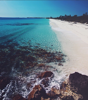 beach, city and cliff