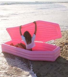 water toys, beach and macabre