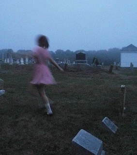 girl, graveyard and ghost