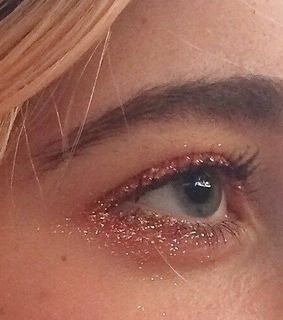 bluish green eye, pink glitter and blue eye