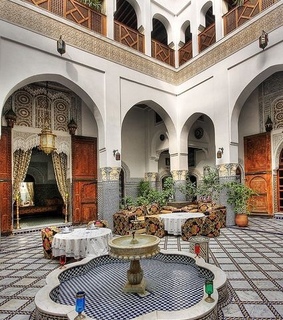 fountain, marrakech and house