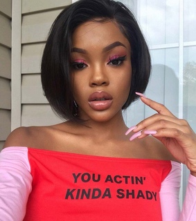 melanin, red lipgloss and golden glow