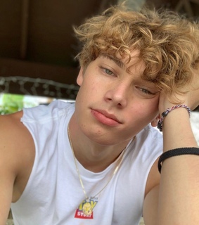 white vest, famous boys and green eyes