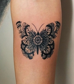 back, tattoos and arm