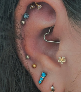 ear piercings, double helix and gold