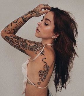 cray, back tattoo and brunette